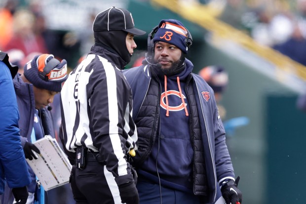 Chicago Bears interim head coach Thomas Brown, right, looks toward down judge Jerod Phillips during the first half of an NFL football game against the Green Bay Packers, Sunday, Jan. 5, 2025, in Green Bay, Wis. (AP Photo/Matt Ludtke)