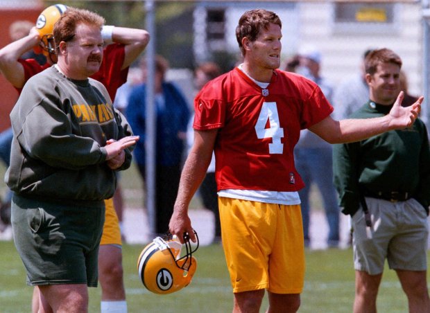 FILE--Green Bay Packers quarterback coach Andy Reid, left, talks with quarterback Brett Favre in this June, 1, 1998 file photo from mini-camp in Green Bay, Wis. Reid had a second interview with the Philadelphia Eagles on Sunday, Jan. 10, 1999 and has emerged as the top candidate to succeed Ray Rhodes. (AP Photo/Mike Roemer)