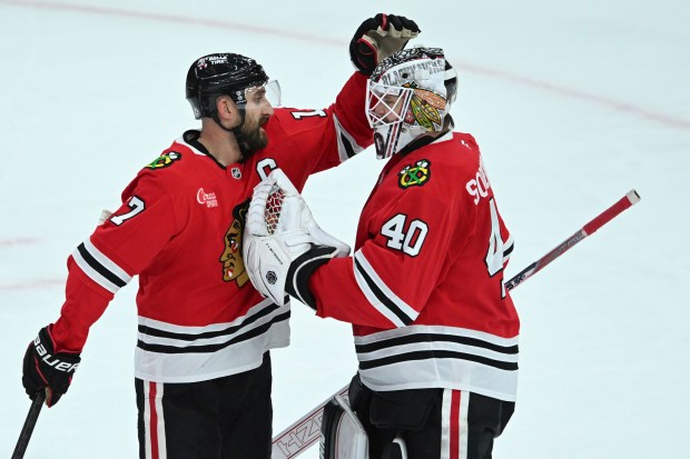 The Blackhawks' Nick Foligno, left, celebrates with goalie Arvid Soderblom after a 4-2 win over the Canadiens on Jan. 3, 2025, at the United Center. (Paul Beaty/AP)