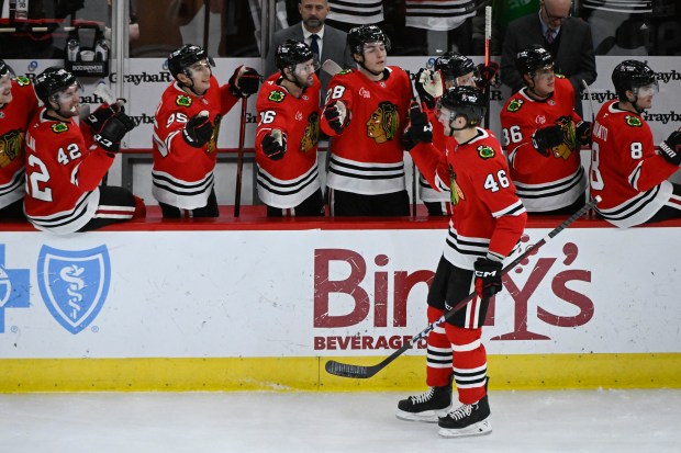 Blackhawks defenseman Louis Crevier celebrates with teammates after scoring a goal against the Lightning during the second period on Jan. 24, 2025, at the United Center. (Matt Marton/AP)