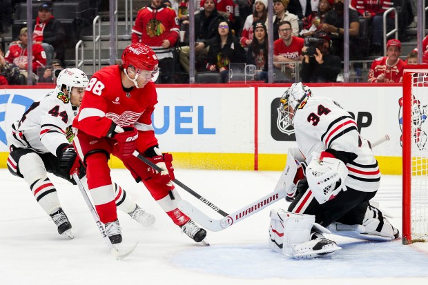 Blackhawks goalie Petr Mrázek blocks a shot by Red Wings forward Patrick Kane in the second period on Jan. 10, 2025, in Detroit. (Mike Mulholland/AP)