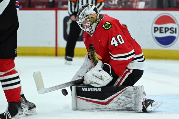 Chicago Blackhawks goalie Arvid Soderblom (40) makes a save during the first period of an NHL hockey game against the New York Rangers, Sunday, Jan. 5, 2025, in Chicago. (AP Photo/Paul Beaty)