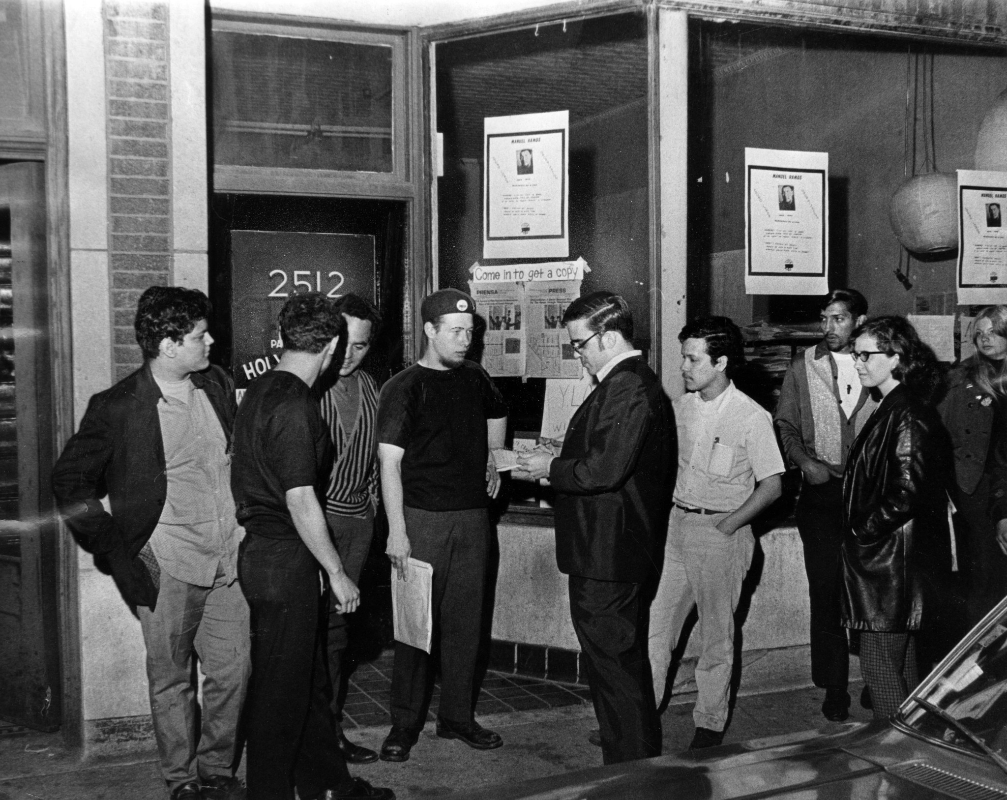 Reporter Jeff Lyon, center right, interviews Jose "Cha-Cha" Jimenez (in...