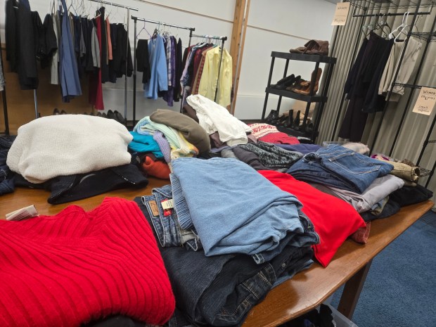 First Congregational Church in Elgin provides the space for a bimonthly clothing closet at which anyone is free to take as much as they like without having to prove need or provide identification. (Gloria Casas/The Courier-News)