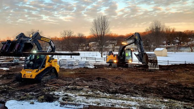 An excavator and skidsteer are being used at the Fox River Trolley Museum in South Elgin to move rails and prepare the ground for construction of an extension to its storage/work barn. (Eric Zabelny)