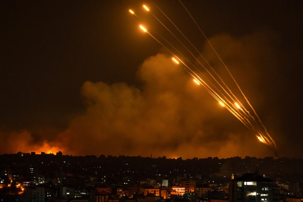 Rockets are fired toward Israel from the Gaza Strip on Oct. 8, 2023.