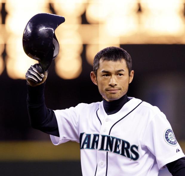 Mariners outfielder Ichiro Suzuki tips his helmet to fans after hitting a single against the Angels on April 16, 2009, in Seattle. (Elaine Thompson/AP)