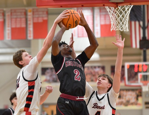 Benet's Colin Stack blocks a shot by Antioch's Marshall Gehrke (2) as Benet's Daniel Pauliukonis also defends during a game on Saturday, Dec. 21, 2024 in Lisle...(Jon Cunningham/f or The Naperville Sun)