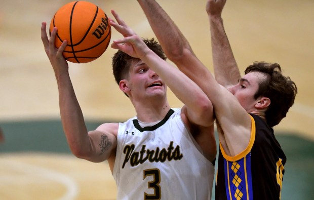 Warren's Jack Wolf (4) fouls Stevenson's Atticus Richmond (3) as he shoots. Stevenson's boys basketball team hosted conference rival Warren Friday, Jan. 10, 2025. (Rob Dicker / for the News Sun)