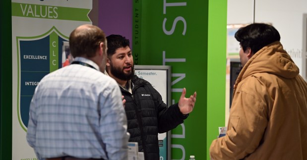 Talking to an event attendee are, from left, Lake County Workforce Development of Waukegan account executives Rob Linderman of Antioch, who attended Grant Community High School in Fox Lake and Omar Ramirez of Libertyville who attended Vernon Hills High School. Taken at the ninth annual Engineering and Technology Career Fair on Jan. 10, 2025 at the College of Lake County (CLC) Grayslake Campus. (Karie Angell Luc/Lake County News-Sun)