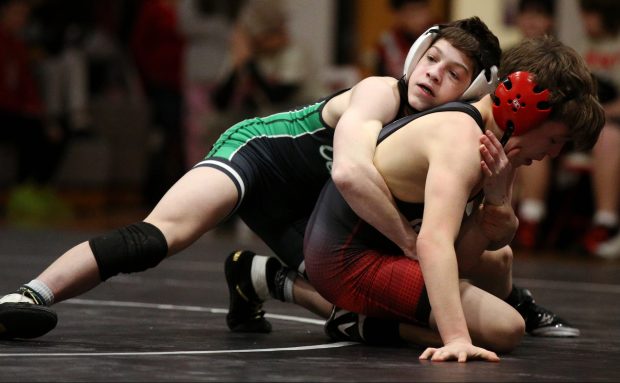 Grayslake Central's Vince DeMarco (green), competing in the 113 lb class, against Grant's Larry Quirk (red), during the match on Thursday, Jan. 16, 2024, in Fox Lake. (Mark Ukena/for the Lake County News-Sun)