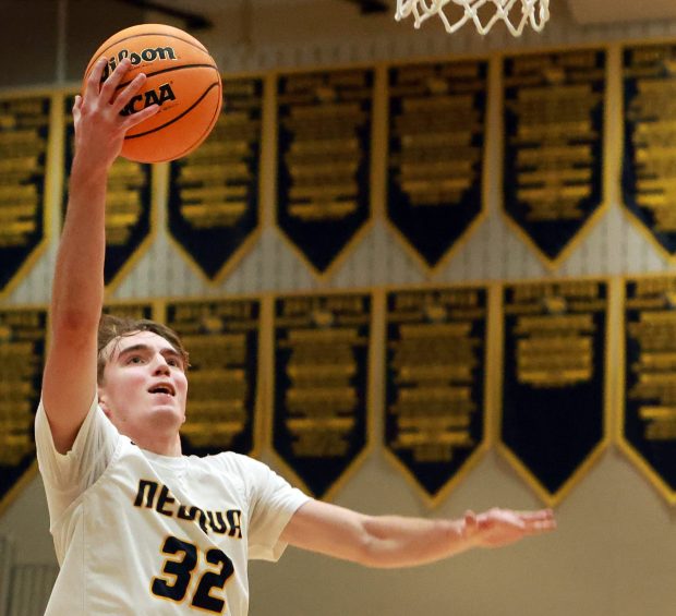 Neuqua Valley's Whitman Charboneau goes for two during the boys basketball game against Leyden in Naperville on Friday, Jan. 17, 2025. (James C. Svehla / Naperville Sun)