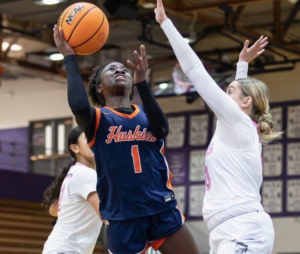 Naperville North's Natalie Frempong (1) goes up for a layup against Downers Grove North during a non conference game in Downers Grove on Tuesday, Jan. 28, 2025. (Troy Stolt / for the Naperville Sun)