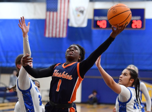 Naperville North's Natalie Frempong (1) lays the ball up during a game against Wheaton North on Tuesday, Jan. 14, 2025 in Wheaton...(Jon Cunningham/for The Naperville Sun)