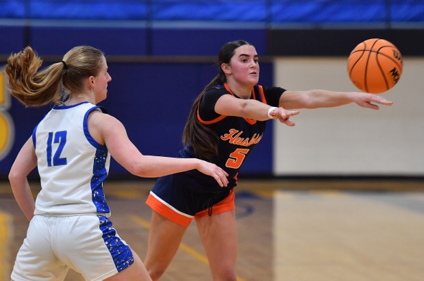 Naperville North's Ava Podkasik (5) passes the ball away from Wheaton North's Anna Leicht during a game on Tuesday, Jan. 14, 2025 in Wheaton...(Jon Cunningham/for The Naperville Sun)