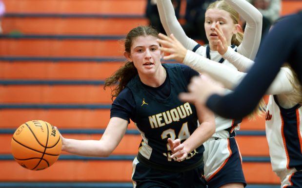 Neuqua Valley's Nalia Clifford passes around Naperville North during the DuPage Valley Conference girls basketball game in Naperville on Thursday, Jan. 13, 2025. (James C. Svehla / Naperville Sun)