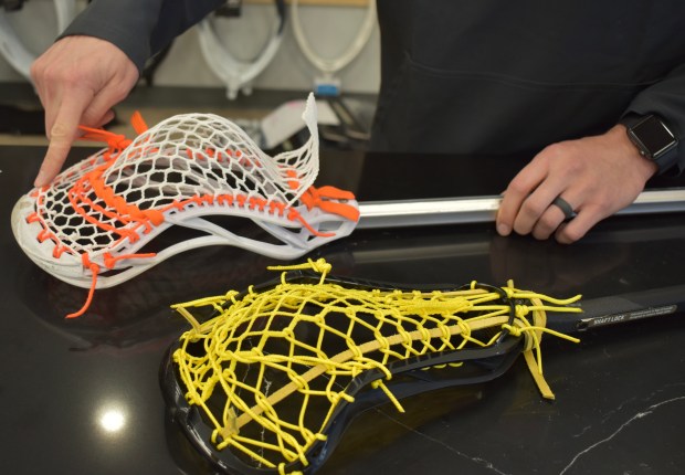 It's important to have the pocket of a lacrosse stick properly strung. Jakob Works of Tama Lacrosse in Naperville estimates he has strung more than 10,000 over the years. (Steve Metsch/Naperville Sun)