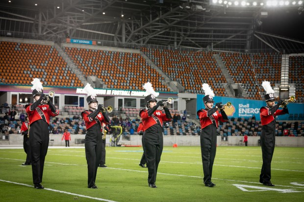 The North Central College Cardinal Marching Band performs a field show during half-time of the Stagg Bowl in Houston on Sunday, Jan. 5, 2025. The band's field show was Bruno Mars-themed. (Susan Chou)