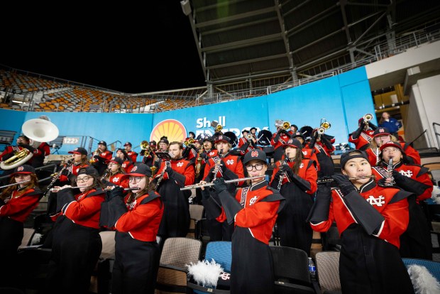 The North Central College Cardinal Marching Band plays in the stands of Shell Energy Stadium in Houston, Texas, at the NCAA Division III national championship game on Sunday, Jan. 5, 2025. (Susan Chou)