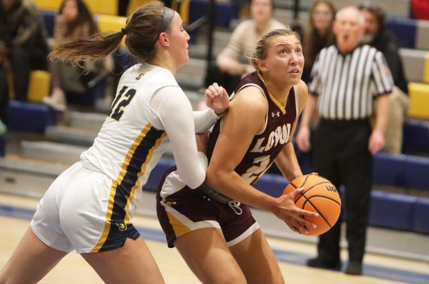 Loyola Academy's Grace Bronski looks to shoot the ball against Glenbrook South's Grace Niedermaier on Thursday, Jan. 30, 2025 in Glenview.