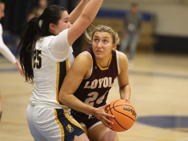 Loyola Academy's Grace Bronski looks to shoot the ball against Glenbrook South's Candace Cheng on Thursday, Jan. 30, 2025 in Glenview.