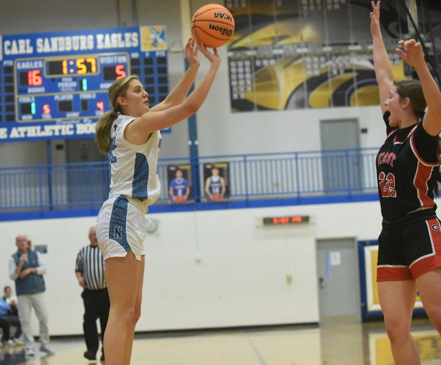 Nazareth's Stella Sakalas (32) puts up a shot against Glenbard East's Lilly Carver (22) during the Sandburg Holiday Classic Thursday, Dec. 26, 2024 in Orland Park, IL. (Steve Johnston/for Pioneer Press)