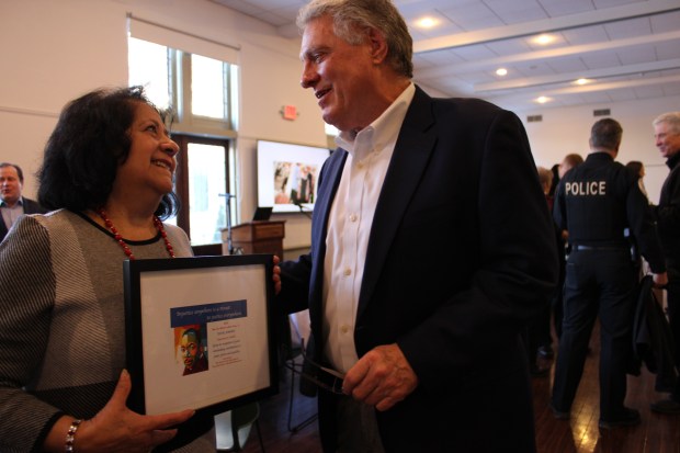 Dove Award recipient, Elena Jonas, executive director, of HACES (Hispanic American Community Education and Services), with Jack Frigo, Lake Forest Bank & Trust board member during the 2nd Annual Martin Luther King Ecumenical Prayer Breakfast, presented by the Church of the Holy Spirit and the Lake Forest/Lake Bluff Ministerium, Friday morning, Jan. 17, 2025. (Gina Grillo/ for the Pioneer Press)