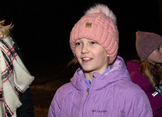 Eleven-year-old Vaiva Lattimer comments on watching the Twelfth Night celebration in Ogden Dunes on Monday, Jan. 6, 2025. (Michael Gard/for the Post-Tribune)