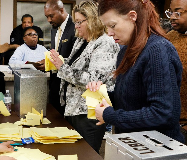 Board of Elections Director Michelle Fajman, center, and Administration Assistant Beth Giles, right, count the votes during a caucus to fill the vacancy left by the resignation of Calumet Township Trustee Kim Robinson, prior to her federal guilty plea last month. The meeting took place at the Calumet Township Multipurpose Center on Jan. 16, 2025. (John Smierciak / Post-Tribune)