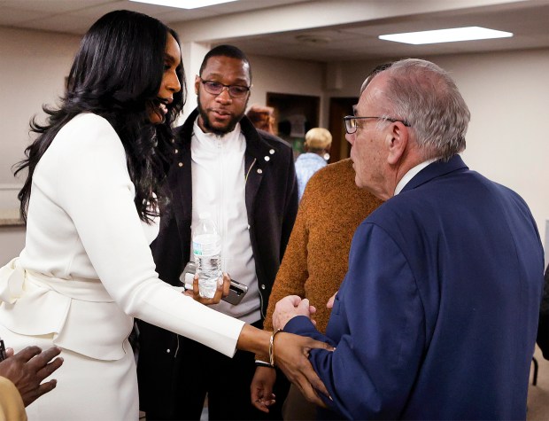 Lake County Democratic Party Chairman Jim Wieser, right, congratulates Tai Adkins, left, after Adkins won the position during a caucus to fill the vacancy left by the resignation of Calumet Township Trustee Kim Robinson. The meeting took place at the Calumet Township Multipurpose Center on Jan. 16, 2025. (John Smierciak / Post-Tribune)