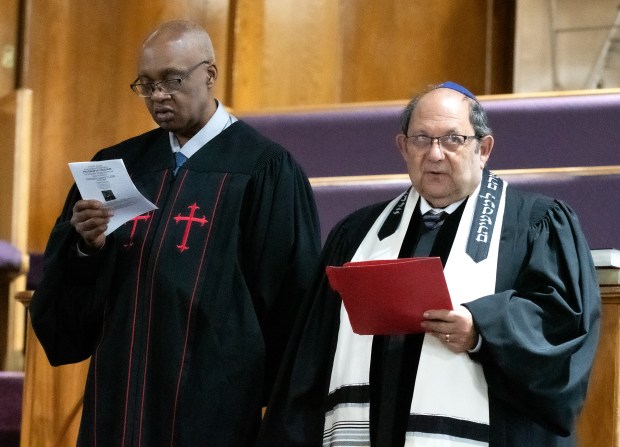 Reverend Ernest Douglas, left, and Rabbi Len Zukrow take part in the 64th Annual Emancipation Proclamation Program of Freedom at First Baptist Church in Gary, Indiana Wednesday Jan. 1, 2025. Zukrow is rabbi at Temple Beth-El in Munster.(Andy Lavalley/for the Post-Tribune)