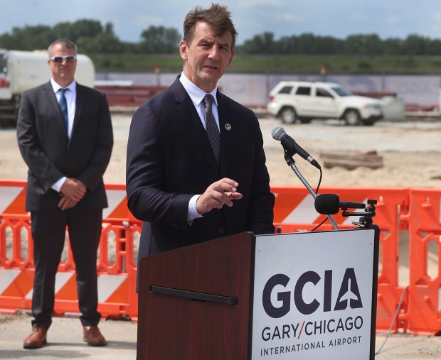 Congressman Frank Mrvan (right) addresses the crowd. Jeromy Montesano (left) president of Wingtip Aviation and the new tenant for the $12 million dollar aircraft hanger listens during a groundbreaking at the Gary/Chicago International Airport on Tuesday, June 18, 2024. (John Smierciak/Post-Tribune)