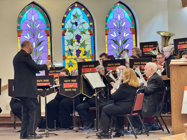 South Shore Brass Band Conductor Vince Arizzi directs the band in playing a song contemporary to the Valparaiso and Northern Interurban Railroad, which ran between Valparaiso and Gary from 1910 to 1938, as part of a program on the railroad Sunday, Jan. 12, 2025. (Doug Ross/for Post-Tribune)