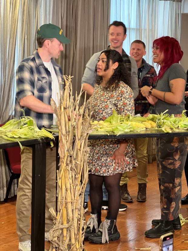 Cast members of the Broadway national tour of "Shucked" conceded defeat following a corn husking competition at CIBC Theatre in Chicago on Tuesday, Jan. 7, 2025, against corny competitors from Chicago's Second City improv team. (Philip Potempa/for Post-Tribune)