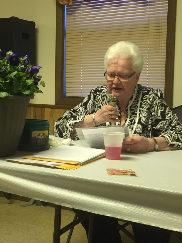 Jeannette Wobith gives a reading of the meeting minutes from the officers' head table at the annual San Pierre Alumni Dinner in April 2017. (Philip Potempa/for Post-Tribune)