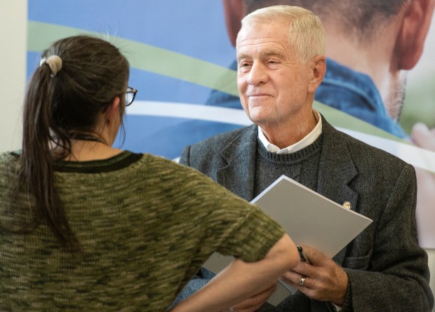 State Sen. Ed Charbonneau (R-Valparaiso) speaks with a member of the audience during an open house and ribbon cutting for a new crisis service unit at Porter-Starke Services in Valparaiso on Thursday, November 30, 2023. (Michael Gard/Post-Tribune)