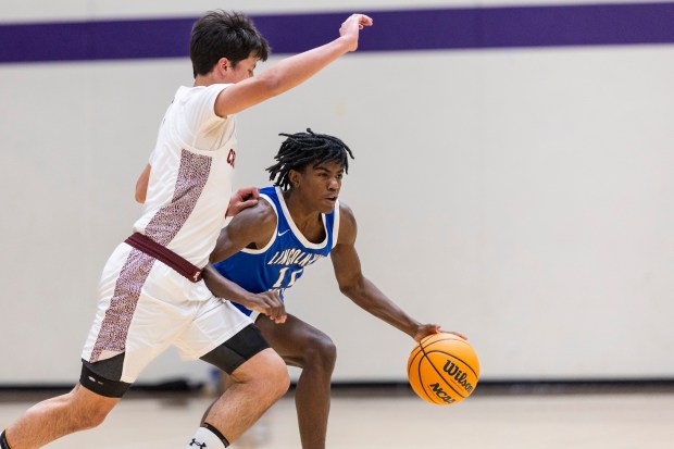 Brother Rice's Jack Weigus guards Lincoln-Way East's Jaymon Hornsby (11) as he dribbles during a game in the Bob Hambric Shootout at T.F. North in Calumet City on Saturday, Jan. 11, 2025. (Vincent D. Johnson / for the Daily Southtown)