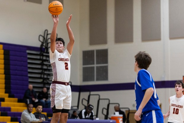 Brother Rice's Jack Weigus (2) hits a three pointer against Lincoln-Way East during a game in the Bob Hambric Shootout at T.F. North in Calumet City on Saturday, Jan. 11, 2025. (Vincent D. Johnson / for the Daily Southtown)