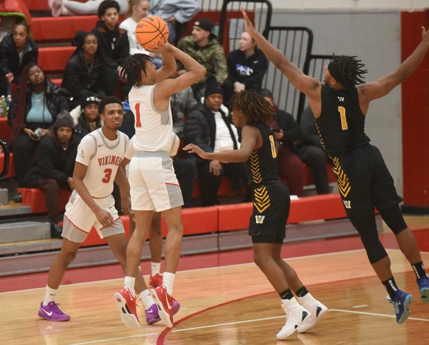 Homewood-Flossmoor's Brent Taylor (1) pulls up for a shot against Joliet West's Mickeis Johnson (1) during the MLK "The Dream Continues" High School Invitational Monday, Jan. 20, 2025 in Flossmoor, IL. (Steve Johnston/for the Daily Southtown)