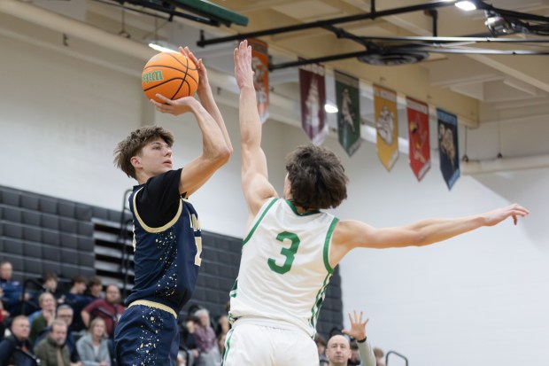 Lemont's Matas Gaidukevicius (20) takes a shot against Oak Lawn during an South Suburban Conference crossover game in Oak Lawn on Friday, Jan. 10, 2025. (Troy Stolt / Daily Southtown)