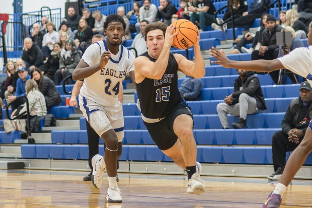 Lincoln-Way East's Luke Vetter (15) drives to the basket against Sandburg during a Southwest Suburban Conference game in Orland Park on Tuesday, Jan. 14, 2025. (Troy Stolt / for the Daily Southtown)