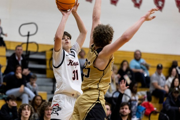 Lincoln-Way Central's Jack Rimkunas (31) puts a up a 3-pointer over Oak Forest's Hayden Noha (25) during a nonconference game in New Lenox on Friday, Jan. 24, 2025. (Vincent D. Johnson / for the Daily Southtown)