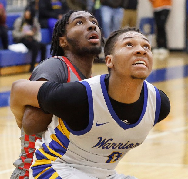 Crete-Monee's Jaylen Blakes, right, boxes in Rich Township's Ikee Brooks, right, as they wait for a rebound during a basketball game in Crete on Friday, Jan..17, 2025 (John Smierciak / Daily Southtown)