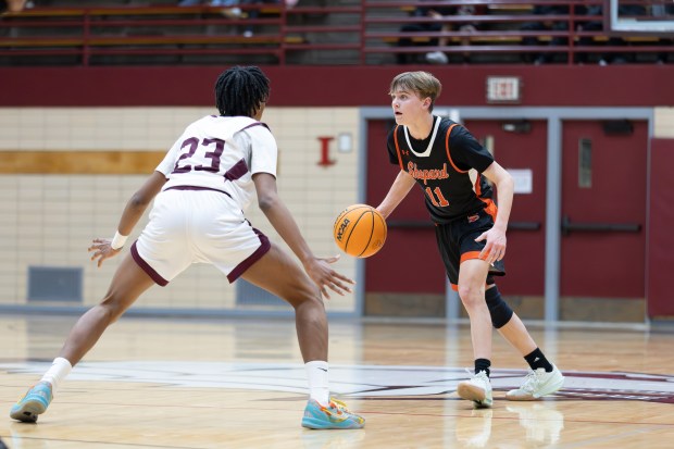 Shepard's Danny McGovern (11) brings the ball down court against Argo during an SSC game in Summit on Friday, Jan. 24, 2025. (Troy Stolt / for the Daily Southtown)