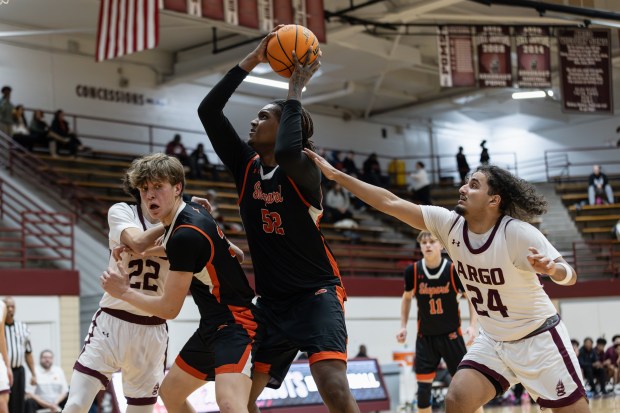 Shepard's Jovan Thomas (52) gets a rebound against Argo during an SSC game in Summit on Friday, Jan. 24, 2025. (Troy Stolt / for the Daily Southtown)