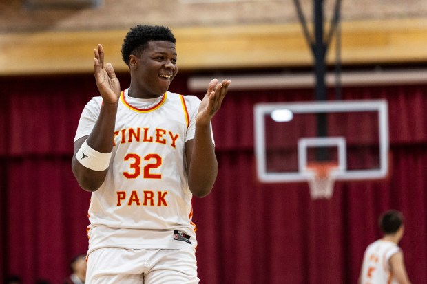 Tinley Park's Kendall Webb reacts after a Titans' three pointer gave them the lead over Shepard during a South Suburban Conference crossover game in Tinley Park on Wednesday, Jan. 22, 2025. (Vincent D. Johnson / for the Daily Southtown)