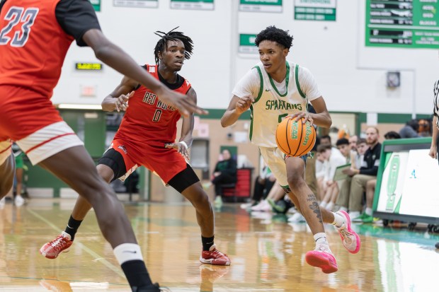 Oak Lawn's Dontè Montgomery (5) drives to the basket against TF South during an SSC game in Oak Lawn on Friday, Jan. 16, 2025. (Troy Stolt / for the Daily Southtown)