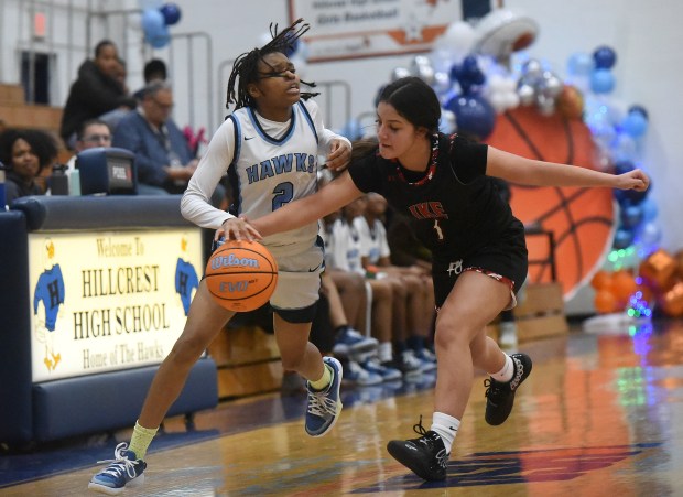 Hillcrest's Dajha Johnson (2) tries to work up court against Eisenhower's Hailey Rodriguez (1) during a South Suburban Conference game Thursday, Jan. 16, 2025 in Country Club Hills, IL. (Steve Johnston/for the Daily Southtown)