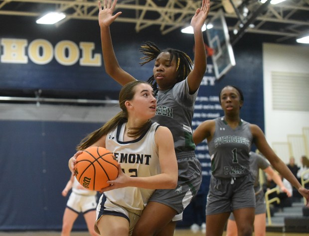 Lemont's Claire Podrebarac (42) tries to work past Evergreen Park's Tatum Harris (11) during a South Suburban Conference game Tuesday, Jan. 14, 2025 in Lemont, IL. (Steve Johnston/for the Daily Southtown)