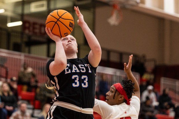 Lincoln-Way East's Kennedy Johnson (33) puts up a shot against Homewood-Flossmoor during a Southwest Suburban Conference game in Flossmoor on Thursday, Jan. 9, 2025. (Vincent D. Johnson / for the Daily Southtown)